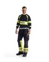 Blaklader Multinorm Craftsman Trousers 1479 #colour_navy-blue-hi-vis-yellow